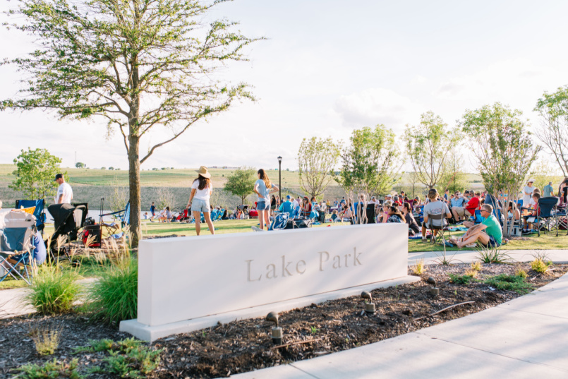 A group of residents enjoying a summer concert in Lake Park.