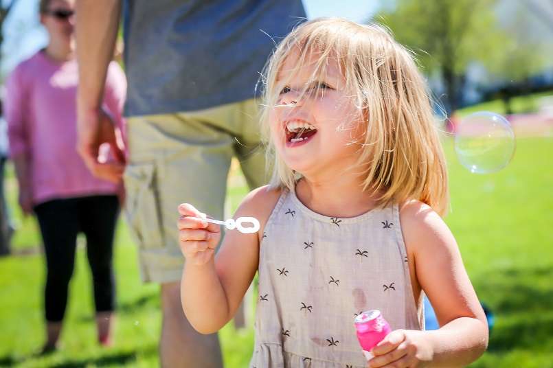 Girl blowing bubbles
