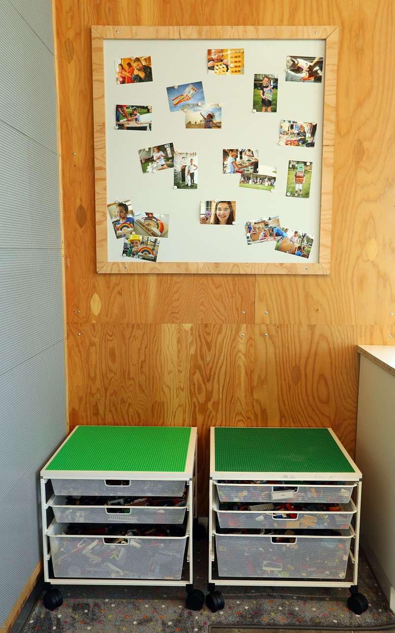Elfa Drawer Units customized with a LEGO board top keep bricks organized.