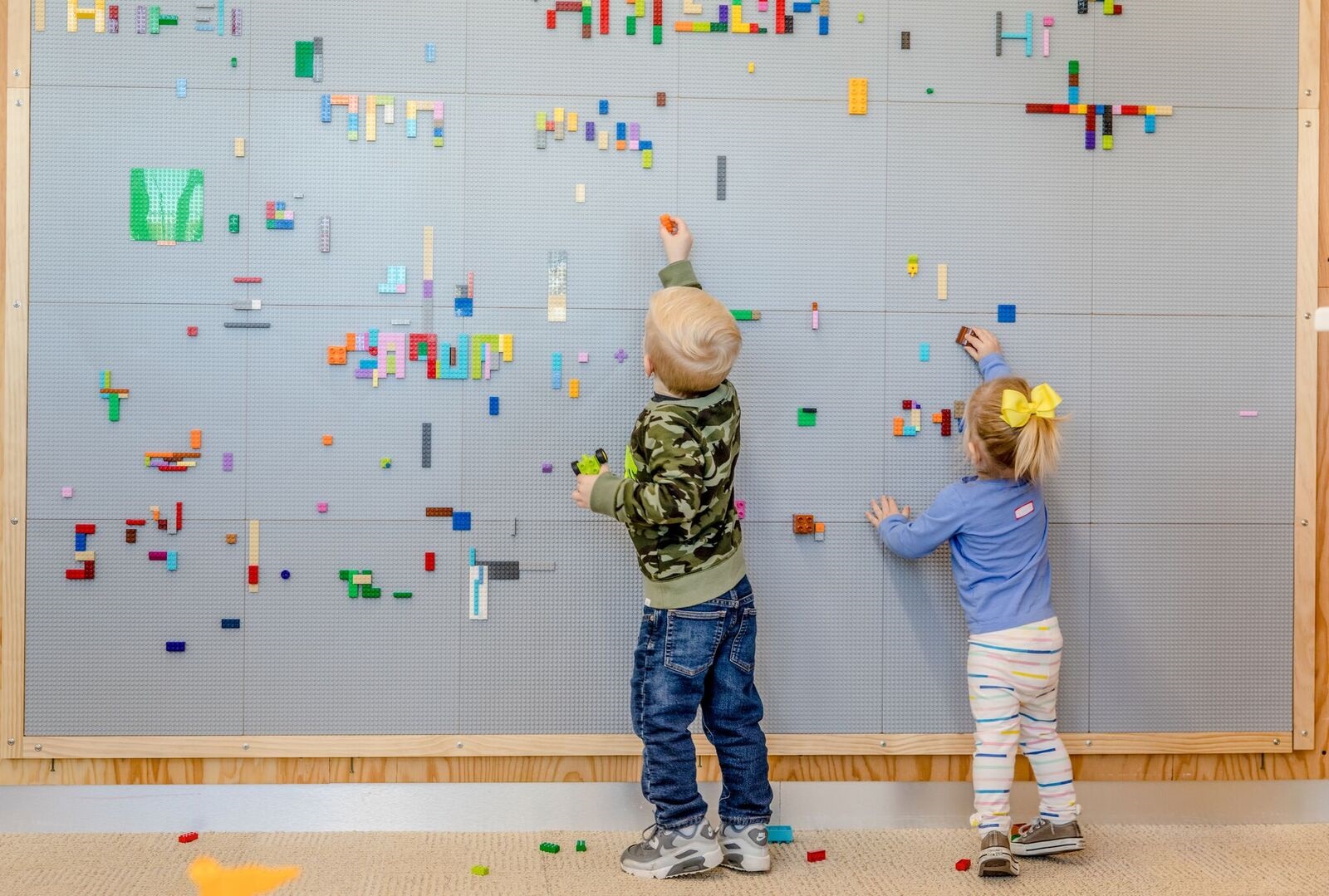 Kids playing with Lego wall