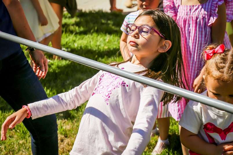Girl concentrating during limbo contest