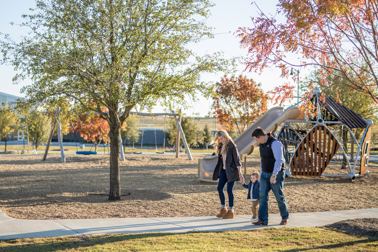 The Mordecai family walks hand in hand at Crescent Park
