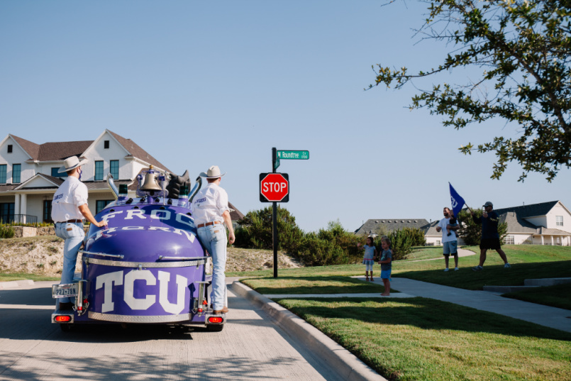 TCU mascot approaches cheering neighbors