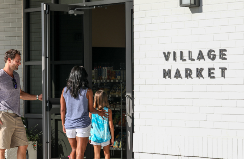Family entering Walsh Village Market