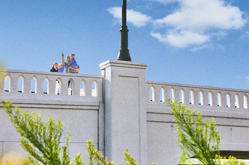 The Wallaces are on the Walsh Ranch Parkway bridge, looking out into the community.