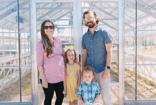 Stacy Barton and family outside the composting collection site