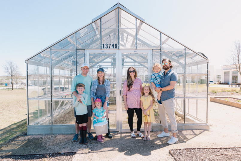 Stacy Barton, Brittany Thompson and their families outside the composting collection site